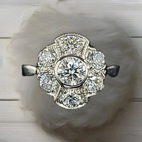 PLATINUM VINTAGE ENGAGEMENT RING 1.25CT. LAB-GROWN ROUND DIAMONDS: PLATINUM VINTAGE ENGAGEMENT RING 1.25CT. LAB-GROWN ROUND DIAMONDS This Platinum Vintage Engagement Ring features 1.25ct of lab-grown round diamonds, with a total of 7 diamonds in the setting. The ring