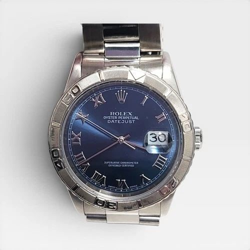ROLEX DATEJUST TURN-O-GRAPH BLUE 36MM WHITE GOLD BEZEL WATCH 16264 W SERIES 1995: ROLEX DATEJUST TURN-O-GRAPH BLUE 36MM WHITE GOLD BEZEL WATCH 16264 W SERIES 1995 Manufacturer Rolex Category Mens Datejust 36mm Subcategory Sapphire Crystal Quick Set Reference Number 16264 Additional