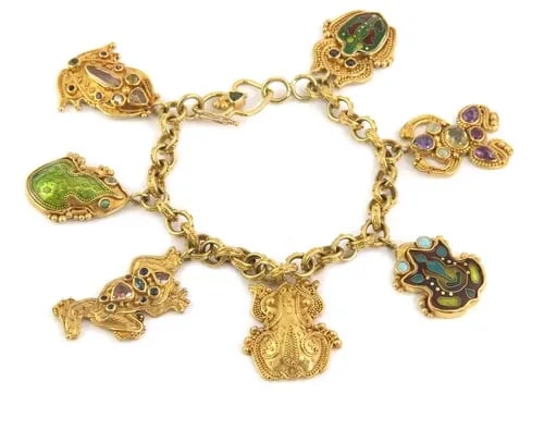 CHARMS BRACELET LUNA FELIX ENAMEL & GEMSTONE 22K 18K GOLD 7 FROGS: CHARMS BRACELET LUNA FELIX ENAMEL & GEMSTONE 22K 18K GOLD 7 FROGS The Luna Felix Charms Bracelet features a delightful design with seven frogs crafted from enamel and gemstones in pink, blue, and red 