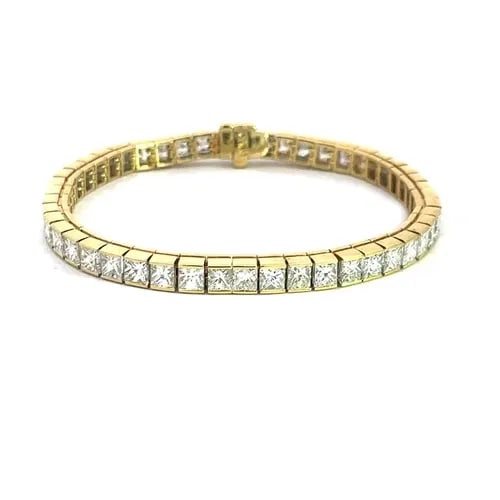 DIAMOND GOLD TENNIS BRACELET 16.CT PRINCESS CUT 18K YELLOW GOLD: DIAMOND GOLD TENNIS BRACELET 16.CT PRINCESS CUT 18K YELLOW GOLD Stunning diamond tennis bracelet, it is crafted from 18k yellow gold featuring cube links with princess cut half bezel set diamonds. The