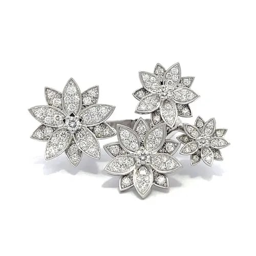 VAN CLEEF & ARPELS RING LOTUS BETWEEN THE FINGER, 4 FLOWERS 18K DIAMONDS: This is a charming authentic ring by Van Cleef & Arpels from the 4 Flowers Lotus Between The Finger Collection. The ring is made from 18k white gold with a polished finish featuring 4 graduated size f