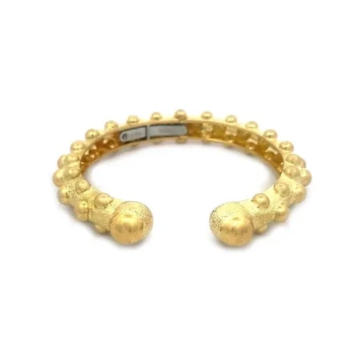 DAVID WEBB GOLD CUFF BRACELET 18K YELLOW HINGED FLEX DOME BAND: DAVID WEBB GOLD CUFF BRACELET 18K YELLOW HINGED FLEX DOME BAND Elevate your jewelry collection with the timeless elegance of David Webb's gold cuff bracelet. Crafted from premium 18k yellow gold, this