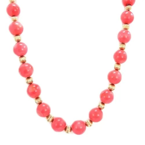 TIFFANY & CO. NECKLACE 14K YELLOW GOLD CORAL BEAD: TIFFANY & CO. NECKLACE 14K YELLOW GOLD CORAL BEAD This Tiffany & Co. Necklace features a stunning 14k yellow gold coral bead as the main stone, giving it a unique and elegant look. The necklace is 22 