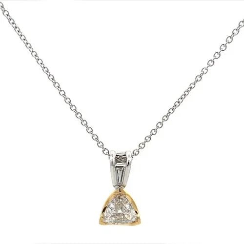 NECKLACE TRILLION CUT DIAMOND 18K GOLD PENDANT 14K WHITE GOLD CHAIN: This 18k gold pendant with a trillion cut diamond is a stunning piece of fine jewelry for women. The pendant is set with a white trillion cut diamond on an 14k white gold oval link chain. The elegant 