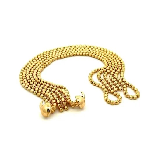 CARTIER DRAPERIE DE DECOLLETE 6 STRAND 18K YELLOW GOLD BEAD BRACELET PAPER: CARTIER DRAPERIE DE DECOLLETE 6 STRAND 18K YELLOW GOLD BEAD BRACELET PAPER This chic authentic bracelet by Cartier from the Draperie Decollete Collection. It is well crafted from 18k yellow gold in a 