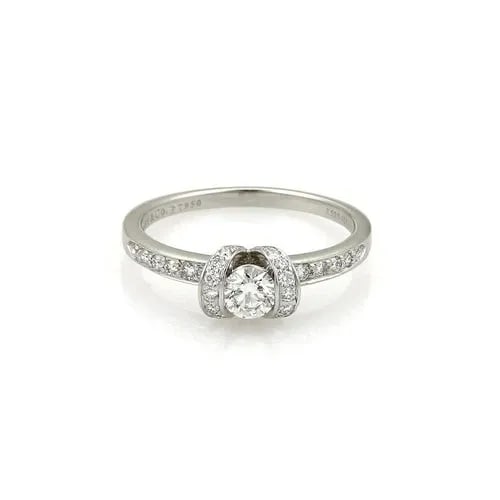 TIFFANY & CO. DIAMOND PLATINUM RING HALF BEZEL STYLE SIZE- 8.5: TIFFANY & CO. DIAMOND PLATINUM RING HALF BEZEL STYLE SIZE- 8.5 The Tiffany & Co. diamond platinum ring is a stunning piece of fine jewelry featuring round cut 0.38ct diamond in the center in half beze