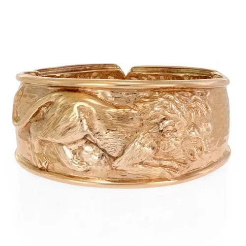 BANGLE BRACELET 14K ROSE GOLD HAMMERED EMBOSSED LION 31MM WIDE: BANGLE BRACELET 14K ROSE GOLD HAMMERED EMBOSSED LION 31MM WIDE This Bangle Bracelet is crafted from 14k rose gold and features a unique hammered embossed design with a lion motif, measuring 31mm wide.