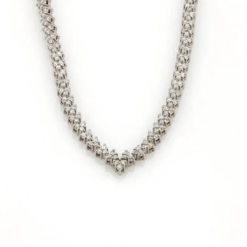 DIAMONDS GOLD V TENNIS NECKLACE 14K WHITE FANCY LEAF LINK STYLE: DIAMONDS GOLD V TENNIS NECKLACE 14K WHITE FANCY LEAF LINK STYLE This is a stunning diamond tennis necklace. It features a V-shaped on the front center with natural white diamonds set in 14k white gold