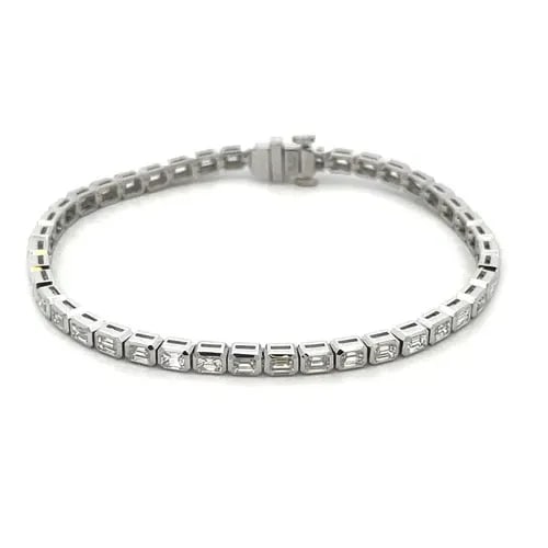 DIAMOND LINE TENNIS BRACELET EMERALD CUT 4.35CT 18K WHITE GOLD NEW: DIAMOND LINE TENNIS BRACELET EMERALD CUT 4.35CT 18K WHITE GOLD NEW This is a gorgeous NEW line tennis bracelet. It is crafted from 18k white gold with a polished finish featuring the entire length of 