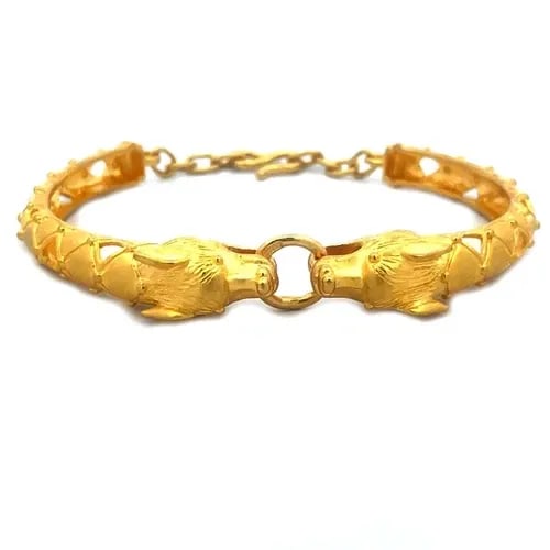 GOLD 24K WOLF BRACELET YELLOW DOUBLE HEAD BAR BAND CHAIN CLASP BRACELET: GOLD 24K WOLF BRACELET YELLOW DOUBLE HEAD BAR BAND CHAIN CLASP BRACELET This beautiful 24k gold bangle features a double wolflike head with a movable ring set between their mouth. The head is attached