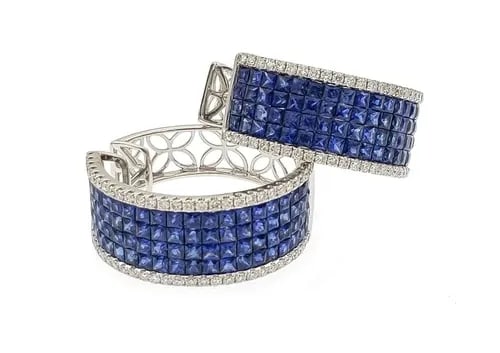 EARRINGS DIAMOND & GEMSTONES 18K WHITE GOLD WIDE HOOP EARRINGS: EARRINGS DIAMOND & GEMSTONES 18K WHITE GOLD WIDE HOOP EARRINGS These earrings feature a stylish wide hoop design in 18k white gold, with sparkling diamond accents and vibrant blue gemstones. The snap 