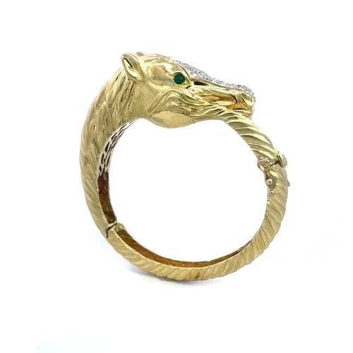 LA TRIOMPHE DIAMOND GOLD BRACELET 14K YELLOW HORSE HINGED BYPASS STYLE: LA TRIOMPHE DIAMOND GOLD BRACELET 14K YELLOW HORSE HINGED BYPASS STYLE This is a beautiful equestrian style bracelet; it is crafted from 14k yellow and white gold accent featuring a polished finish ho