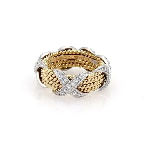 TIFFANY & CO RING SCHLUMBERGER DIAMOND PLATINUM 18K 4 X DESIGN SIZE 4.75: TIFFANY & CO RING SCHLUMBERGER DIAMOND PLATINUM 18K 4 X DESIGN SIZE 4.75 The product is a luxurious Tiffany & Co. ring featuring round-cut white diamonds set in 18k gold and platinum. The Schlumberger