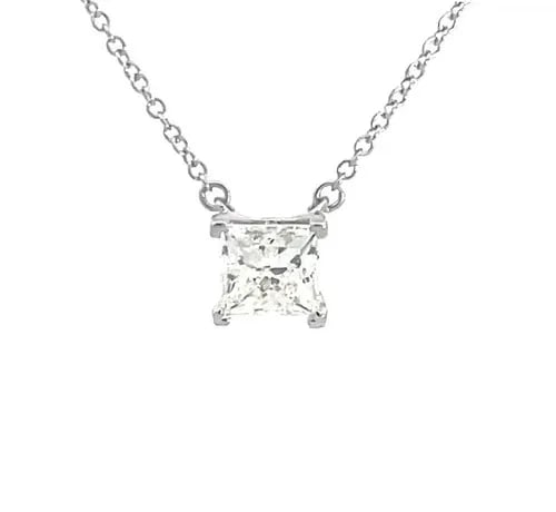 TIFFANY & CO. DIAMOND SOLITAIRE PENDANT PRINCESS CUT 1.15CT PLATINUM CHAIN: TIFFANY & CO. DIAMOND SOLITAIRE PENDANT PRINCESS CUT 1.15CT PLATINUM CHAIN This elegant necklace is from Tiffany & Co. featuring a stunning VS1 princess cut diamond in platinum four prong basket setti