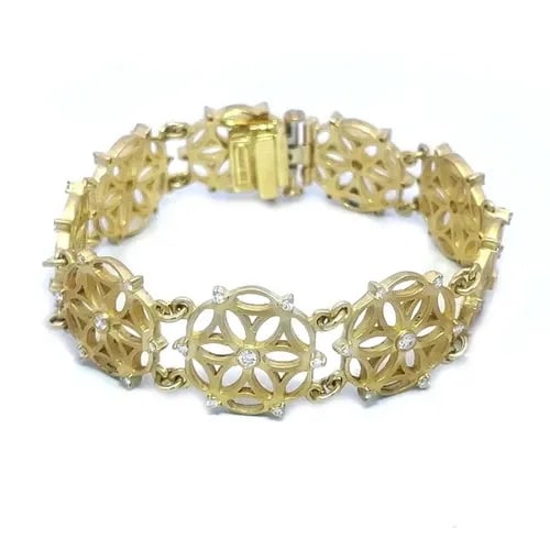 SAM LEHR DIAMOND GOLD BRACELET 18K YELLOW CIRCLE FLORAL FILIGREE LINK STYLE: The Sam Lehr Diamond Gold Bracelet is a stunning piece of fine jewelry featuring round floral fliligree links in 18k yellow gold. The bracelet is adorned with round white diamonds set in bezel and pro