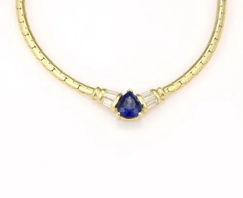 DIAMOND SAPPHIRE GOLD NECKLACE 18K YELLOW PEAR SHAPE CENTERPIECE: DIAMOND SAPPHIRE GOLD NECKLACE 18K YELLOW PEAR SHAPE CENTERPIECE This beautiful gold necklace features a gorgeous pear-shaped centerpiece with a pear shape sapphire gemstone in the center accented wit
