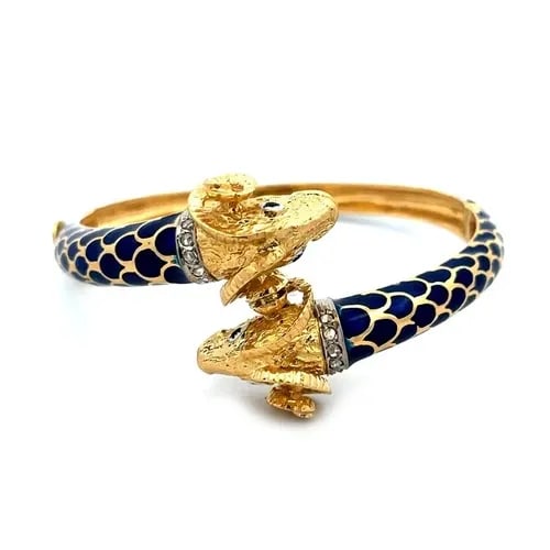 GOLD RAMS HEAD BRACELET DOUBLE HEAD 18K YELLOW HINGE BANGLE BLUE ENAMEL VINTAGE: GOLD RAMS HEAD BRACELET DOUBLE HEAD 18K YELLOW HINGE BANGLE BLUE ENAMEL VINTAGE This is an impressive vintage and detailed sculpted bypass bracelet; it is crafted from 18k yellow gold featuring a doub