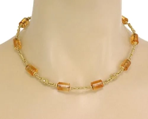JUDITH RIPKA NECKLACE DIAMOND CITRINE LONG BEAD MOTIFS 18K YELLOW GOLD: The Judith Ripka Necklace is a stunning piece of fine jewelry that features citrine beads with diamond motifs in 18k yellow gold. The necklace has a lobster closure and measures 17 inches in length. T