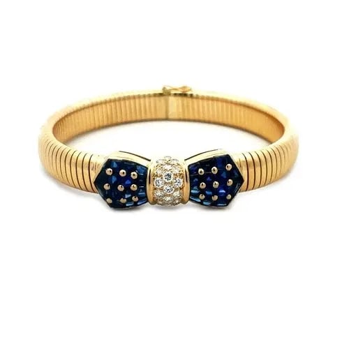 TIFFANY & CO. DIAMOND GOLD BRACELET 18K YELLOW SAPPHIRE BOW MOTIF FRANCE: TIFFANY & CO. DIAMOND GOLD BRACELET 18K YELLOW SAPPHIRE BOW MOTIF FRANCE This lovey gold bracelet is from Tiffany & Co. France, it is an eye-catching fine vintage jewelry featuring a 9mm wide omega ba