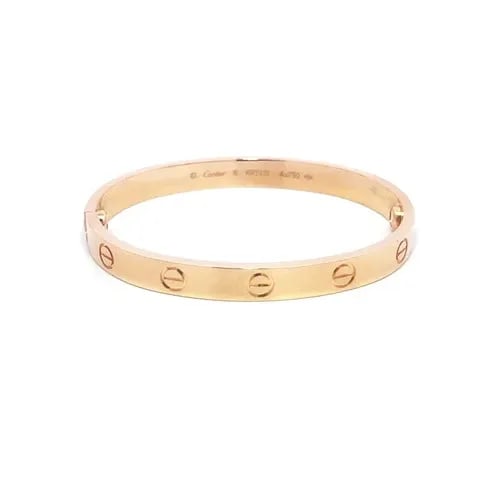 CARTIER LOVE GOLD BANGLE CLASSIC MODEL 18K ROSE SIZE 16 BOX & PAPER: CARTIER LOVE GOLD BANGLE CLASSIC MODEL 18K ROSE SIZE 16 BOX & PAPER This elegant bangle is by Cartier, from 18k rose gold, it features a screw closure and signed by the brand. This classic model bangl