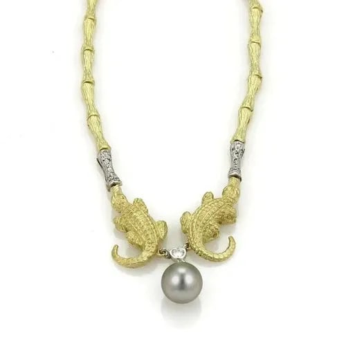 DIAMOND GOLD PEARL NECKLACE 18K YELLOW ALLIGATOR LOG MOTIF BAMBOO LINKS: DIAMOND GOLD PEARL NECKLACE 18K YELLOW ALLIGATOR LOG MOTIF BAMBOO LINKS This unique combination of natural elements features an 18k yellow gold with a textured finish featuring long bamboo shaped link