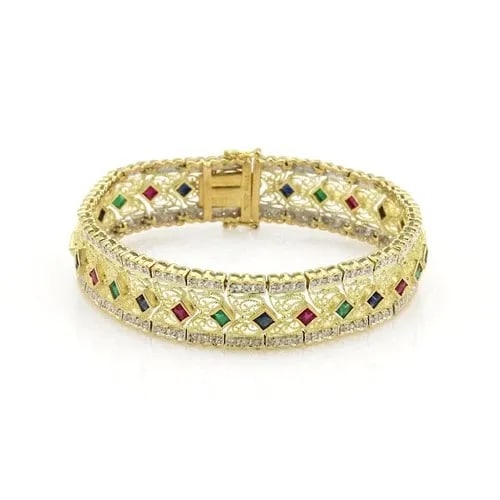 DIAMOND & GEMS GOLD BRACELET 14K YELLOW WIDE FILIGREE STYLE: DIAMOND & GEMS GOLD BRACELET 14K YELLOW WIDE FILIGREE STYLE This is a lovely, impressive Estate bracelet is crafted from 14k yellow gold with a fine polished finish and a beautiful open filigree desig