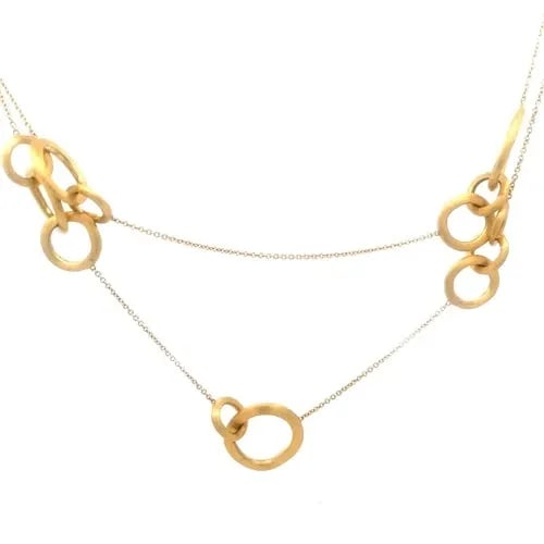 MARCO BICEGO JAIPUR GOLD NECKLACE 18K YELLOW LONG CHAIN MULTI-RING STATION 36" L: This Marco Bicego Jaipur Gold Necklace features a stunning long oval link chain with assorted size triple and double ring motifs set along the entire length of the chain, crafted in 18k yellow gold. T