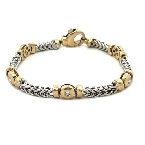 DIAMOND GOLD BRACELET 14K HEAVY TWO-TONE CHEVRON DOT LINK STYLE: DIAMOND GOLD BRACELET 14K HEAVY TWO-TONE CHEVRON DOT LINK STYLE This elegant bracelet is crafted from 14k yellow and white gold featuring alternating chevron links in white gold which alternates with 