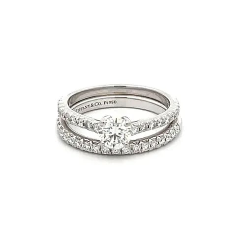 TIFFANY &CO. ENGAGEMENT WEDDING RING SET PLATINUM SOLITAIRE W/ACCENT & BAND: TIFFANY &CO. ENGAGEMENT WEDDING RING SET PLATINUM SOLITAIRE W/ACCENT & BAND This elegant authentic wedding ring and band set is from Tiffany & Co. They are crafted from platinum with a polished finish