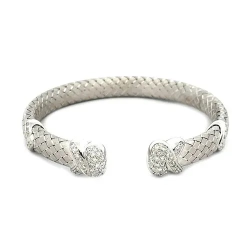 DIAMOND GOLD CUFF BRACELET 18K WHITE PAVE SET BASKET WEAVE STYLE ARIMAR: DIAMOND GOLD CUFF BRACELET 18K WHITE PAVE SET BASKET WEAVE STYLE ARIMAR The Diamond Gold Cuff Bracelet signed Arimar is a stunning piece of fine jewelry crafted from 18k white gold. The bracelet featu