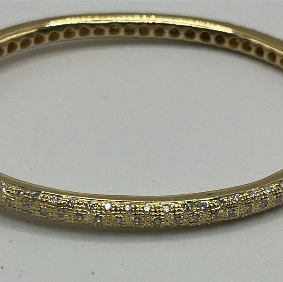 7" 18K YELLOW GOLD BANGLE WITH DIAMONDS 23.8 GRAMS: 7" 18K YELLOW GOLD BANGLE WITH DIAMONDS 23.8 GRAMS 7" 18K YELLOW GOLD BANGLE WITH DIAMONDS 23.8 GRAMS This exquisite bangle bracelet is made of 18k yellow gold and adorned with 218 round-shaped diamon
