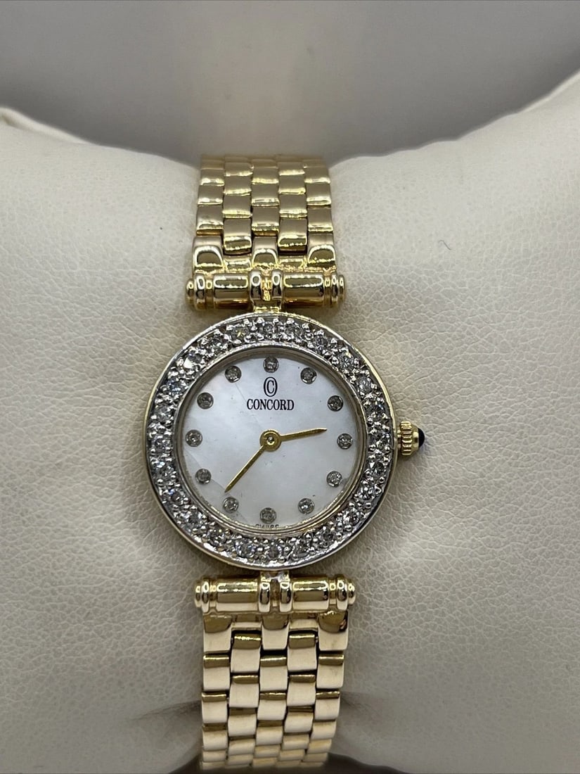 14K YELLOW GOLD LADIES CONCORD WATCH WITH DIAMONDS AROUND BEZEL AND AT NUMBERS (1 of 1)