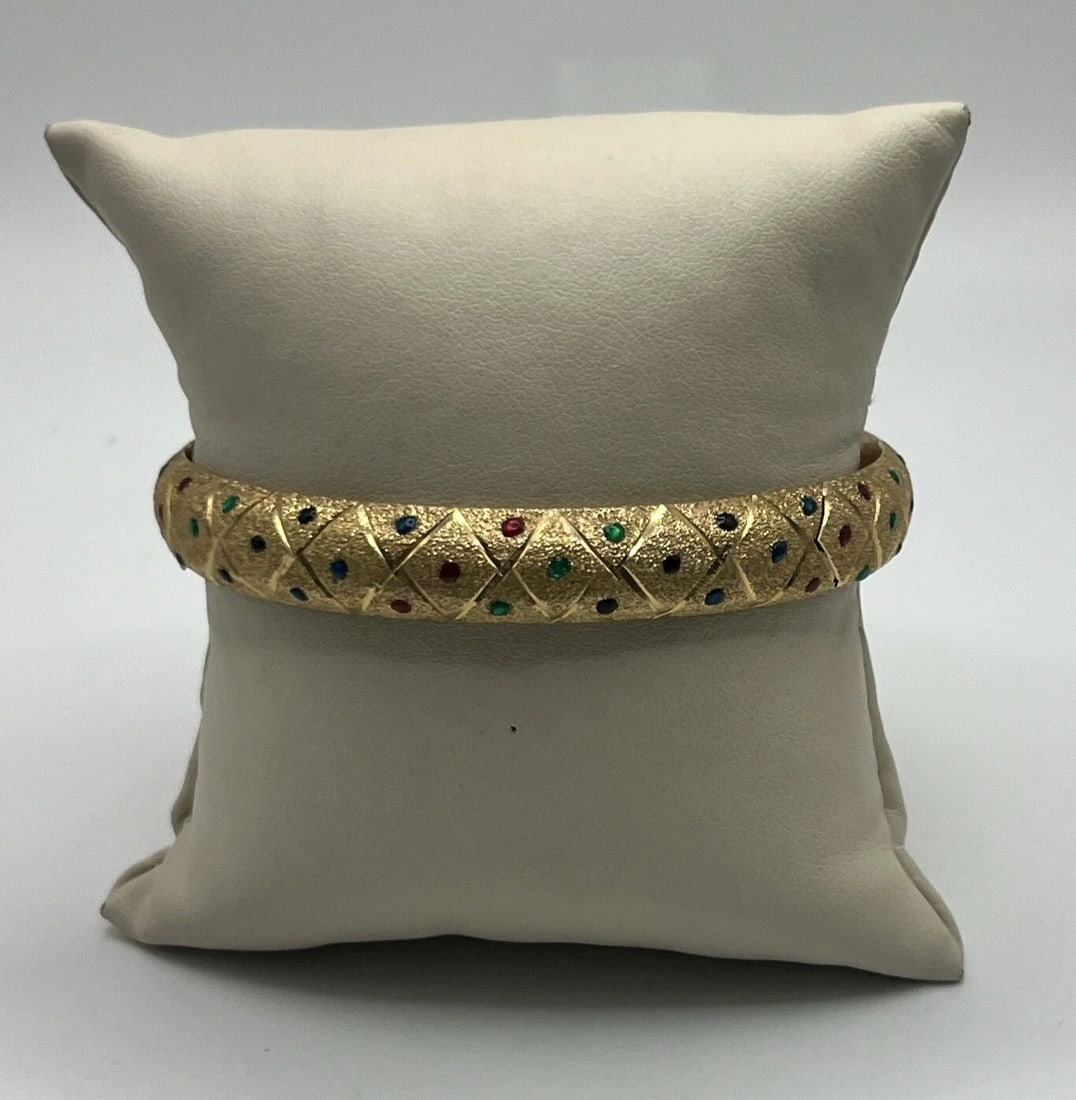 14KT YELLOW GOLD BANGLE WITH MULTI-COLORED ENAMEL 17.6 GRAMS: 14KT YELLOW GOLD BANGLE WITH MULTI-COLORED ENAMEL 17.6 GRAMS 14KT YELLOW GOLD BANGLE WITH MULTI-COLORED ENAMEL 17.6 GRAMS Add a pop of color to your jewelry collection with this stunning 14KT yellow g