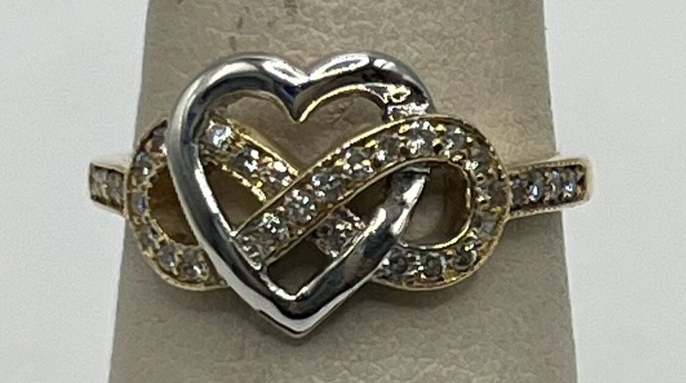 14K WHITE, YELLOW GOLD AND DIAMOND HEART& INFINITY RING SIZE 7.75: 14K WHITE, YELLOW GOLD AND DIAMOND HEART& INFINITY RING SIZE 7.75 14K WHITE, YELLOW GOLD AND DIAMOND HEART& INFINITY RING SIZE 7.75 This stunning ring features a heart-shaped design with an infinity s