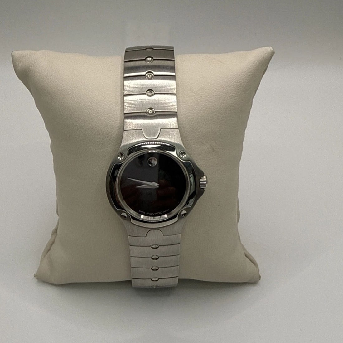 LADIES MOVADO MUSEUM SPORTS EDITION WATCH The Ladies Movado Museum Sports Edition Watch is a stylish: The Ladies Movado Museum Sports Edition Watch is a stylish wristwatch designed for women. Made with stainless steel band material and a black dial color, this Swiss-made timepiece features the iconic 