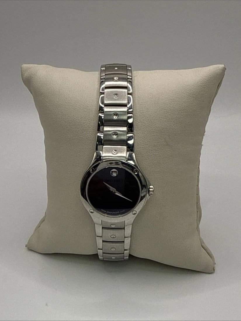 LADIES SMALL FACE MOVADO MUSEUM SPORTS EDITION WATCH The Ladies Small Face Movado Museum Sports: The Ladies Small Face Movado Museum Sports Edition Watch is a stylish and versatile wristwatch designed specifically for women. Made with a stainless steel band and featuring a sleek black dial, this 