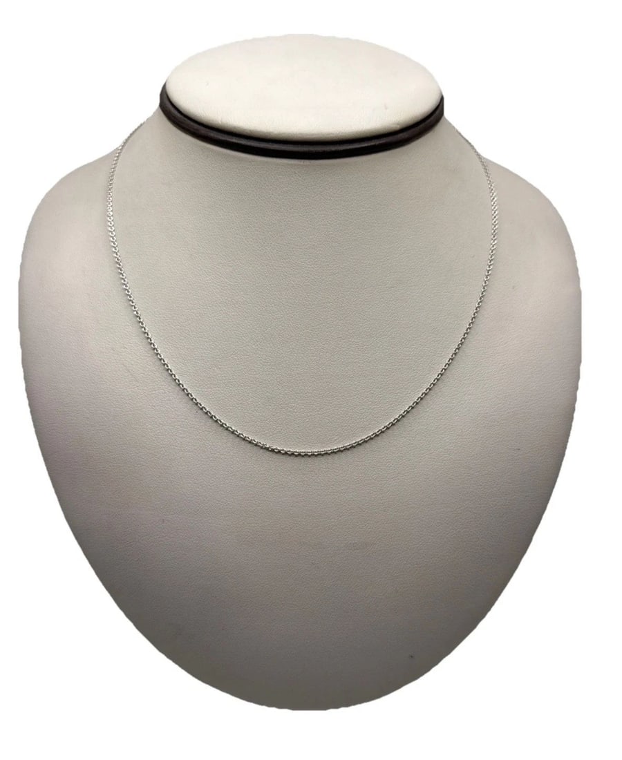 18K MOVADO 16" WHITE GOLD CHAIN 3.5 GRAMS: 18K MOVADO 16" WHITE GOLD CHAIN 3.5 GRAMS The 18K Movado 16" White Gold Chain is a luxurious and elegant piece of fine jewelry. Crafted from high-quality white gold, this necklace features a classic c