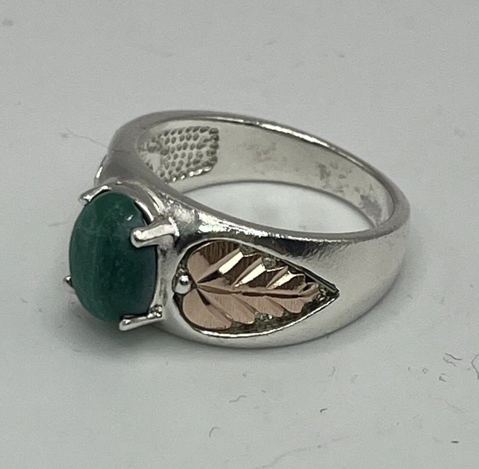C CO. STERLING SILVER AND 12K TURQUOISE RING SIZE 7: C CO. STERLING SILVER AND 12K TURQUOISE RING SIZE 7 C CO. STERLING SILVER AND 12K TURQUOISE RING SIZE 7 This beautiful ring is made by C Co. with sterling silver and 12K gold. The center stone is a st
