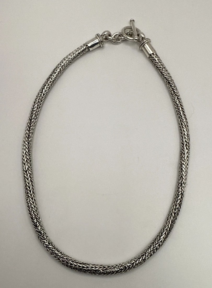 STERLING SILVER TWISTED WHEAT 16" NECKLACE 50.7 GRAMS: STERLING SILVER TWISTED WHEAT 16" NECKLACE 50.7 GRAMS This Sterling Silver Twisted Wheat 16" Necklace weighs 50.7 grams and features a unique birdcage design intricately twisted into a sleek chain sty