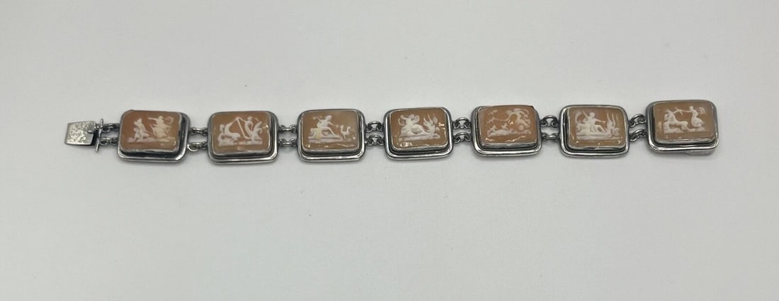HAND CREATED 7 DAY CAMEO SILVER 7" BRACELET: HAND CREATED 7 DAY CAMEO SILVER 7" BRACELET HAND CREATED 7 DAY CAMEO SILVER 7" BRACELET This bracelet features seven cornelian shell cameos with various scenes of Roman mythology, including chariots a