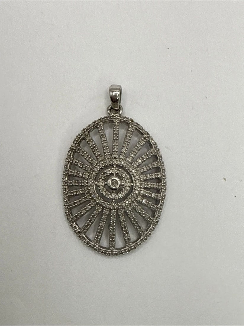 OPENWORK STERLING SILVER & SINGLE CUT DIAMONDS OVAL PENDANT: OPENWORK STERLING SILVER & SINGLE CUT DIAMONDS OVAL PENDANT This Sterling Silver & Single Cut Diamonds Oval Pendant is a luxurious piece of fine jewelry that exudes elegance and sophistication. Crafte