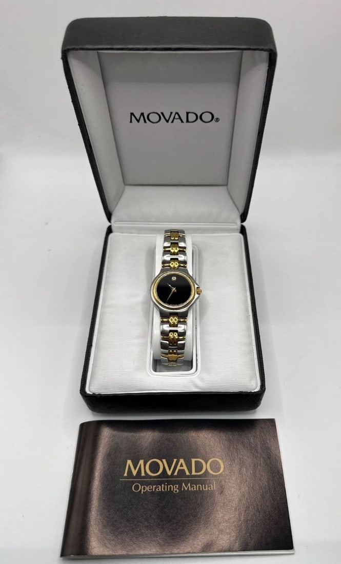 MOVADO MUSEUM LADIES WATCH 2-TONE 81.A1.827.2 QUARTZ: MOVADO MUSEUM LADIES WATCH 2-TONE 81.A1.827.2 QUARTZ The Movado Ladies 2-Tone Stainless Steel Black Dial 81.A1.827.2 Swiss Quartz Watch is a classic timepiece designed for women. Featuring a sleek rou