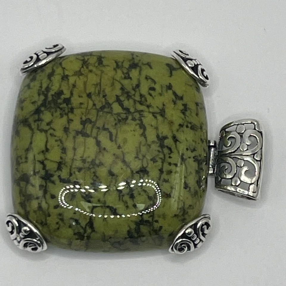 LARGE MIDWEST AMBER PENDANT 58.1 GRAMS: LARGE MIDWEST AMBER PENDANT 58.1 GRAMS LARGE MIDWEST AMBER PENDANT 58.1 GRAMS This large Midwest Amber pendant weighs 58.1 grams and features a square-shaped green Amber gemstone set in sterling silve