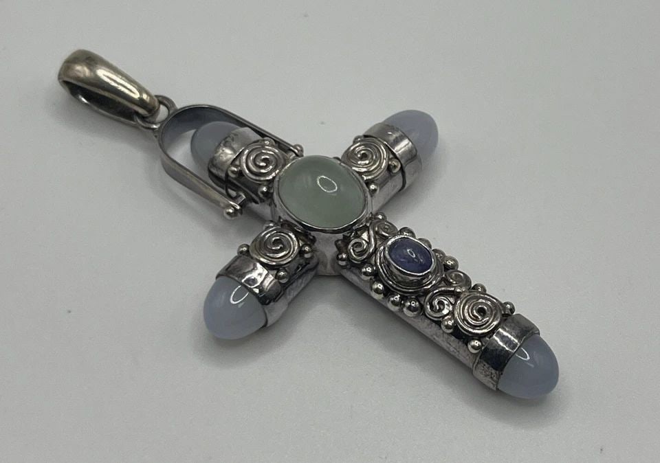 PRINCESS DIANA STYLE SAJEN STERLING SILVER LAVENDER MOONSTONE TOPAZ CROSS: Princess Diana Style Sajen Sterling Silver Lavender Moonstone Topaz Cross This exquisite pendant from Sajen is a must-have for any jewelry collection. Crafted in 925 sterling silver, it features a bea