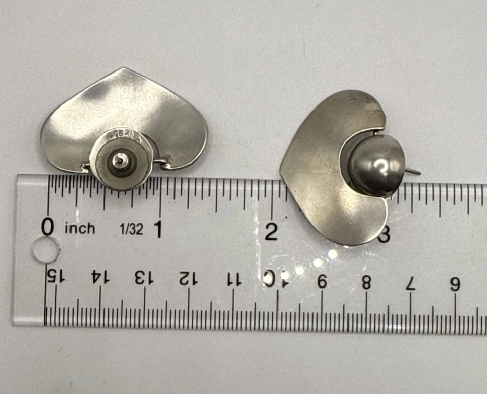 STERLING SILVER DOOR KNOCKER EARRINGS: STERLING SILVER DOOR KNOCKER EARRINGS These Sterling Silver Door Knocker Earrings exude elegance and sophistication. Crafted from 925 sterling silver, they feature a dangle/drop style that adds a touc