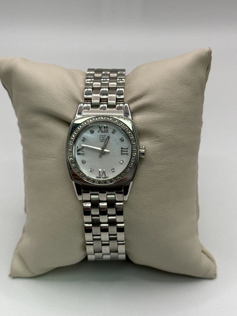 ESQ LADIES STAINLESS STEEL QUARTZ DIAMOND BEZEL MOTHER OF PEARL DIAL WATCH The Ladies Movado Museum: The Ladies Movado Museum Sports Edition Two Tone Watch is a stylish wristwatch designed for women by the renowned brand Movado. It features a sleek stainless steel band in two tones and a black dial, 
