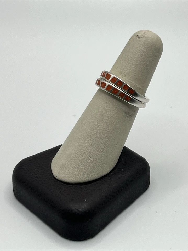 TWO STERLING SILVER RINGS WITH ORANGE CHIP INLAYS SIZE 7.25: TWO STERLING SILVER RINGS WITH ORANGE CHIP INLAYS SIZE 7.25 TWO STERLING SILVER RINGS WITH ORANGE CHIP INLAYS SIZE 7.25 Add a pop of color to your wardrobe with these two beautiful sterling silver rin