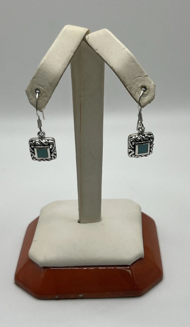 STERLING SILVER AND TURQUOISE DANGLE/HANGING EARRINGS: STERLING SILVER AND TURQUOISE DANGLE/HANGING EARRINGS STERLING SILVER AND TURQUOISE DANGLE/HANGING EARRINGS Add a touch of elegance to your jewelry collection with these beautiful Sterling Silver and 