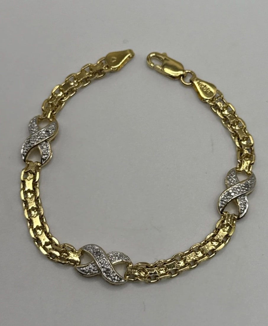 7" GOLD COLORED 925 BRACLET WITH COLORLESS STONES (1 of 2)