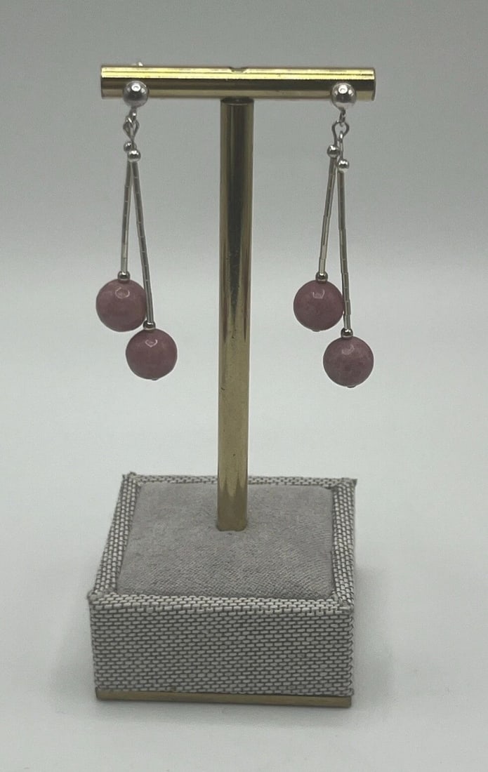 STERLING SILVER DANGLE EARRINGS WITH PINK STONES: STERLING SILVER DANGLE EARRINGS WITH PINK STONES STERLING SILVER DANGLE EARRINGS WITH PINK STONES These stunning earrings are the perfect addition to any jewelry collection. Crafted from high-quality 